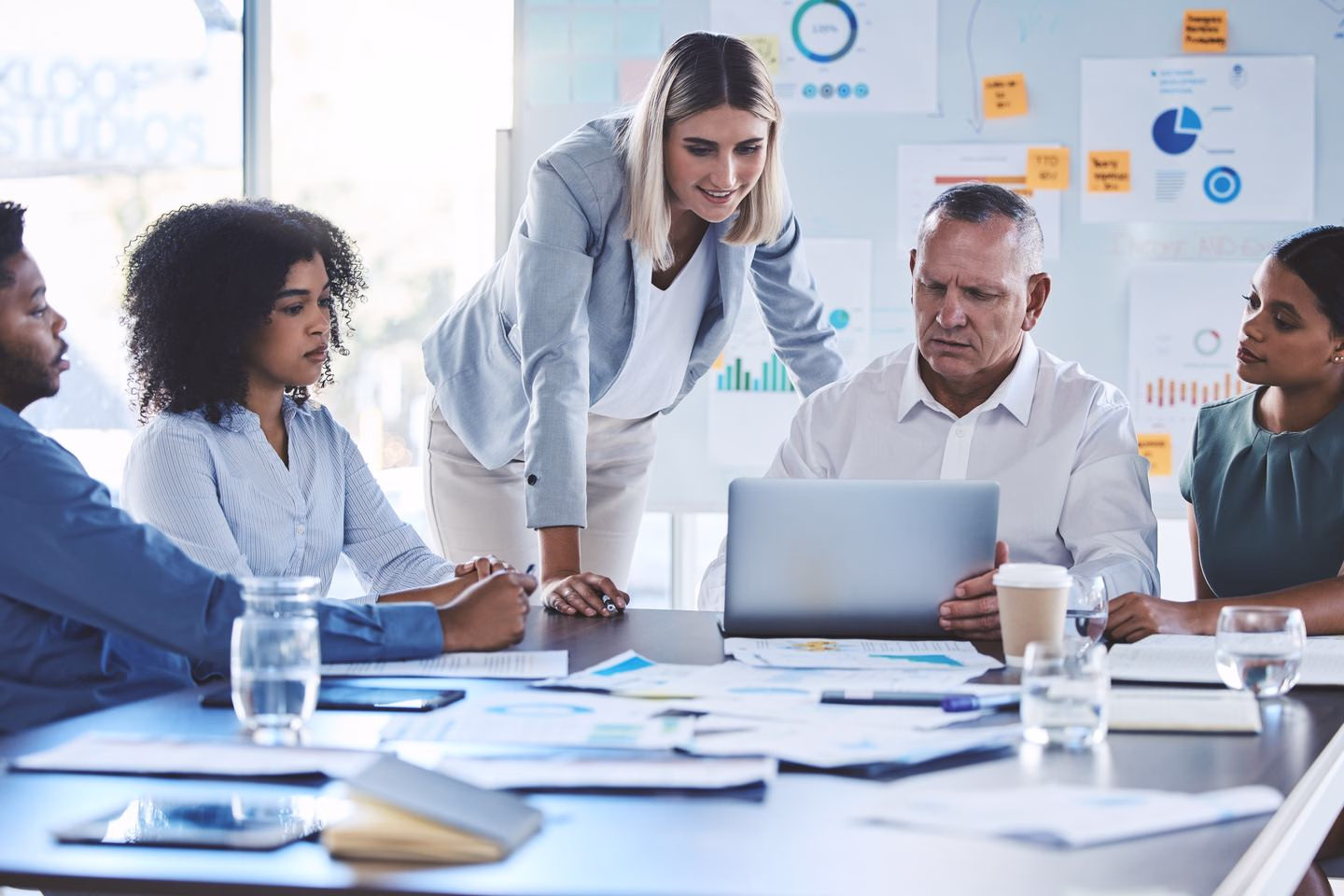Business team planning an online marketing strategy — Source Select.