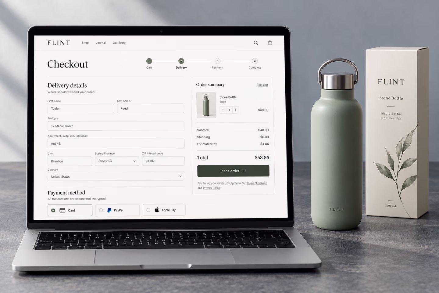 Online checkout displayed on a laptop beside a product and parcel — SourceSelect.ca.