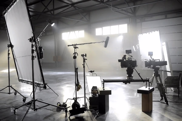 Professional studio lighting and camera equipment — Source Select.